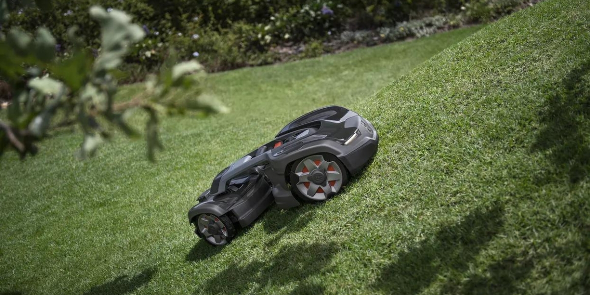 robotic Husqvarna Automower mowing lush green lawn